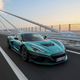 A photo of a green Rimac Nevera electric supercar.
